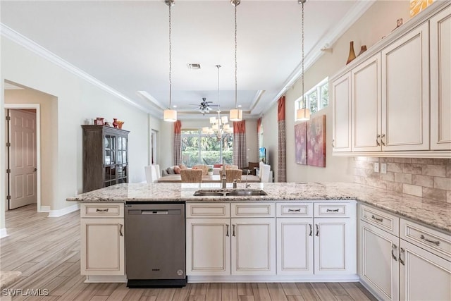 kitchen featuring a peninsula, a sink, visible vents, hanging light fixtures, and stainless steel dishwasher