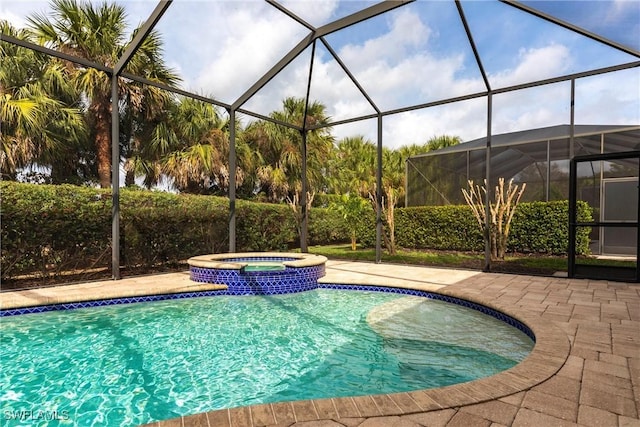 view of swimming pool with a patio, a lanai, and a pool with connected hot tub