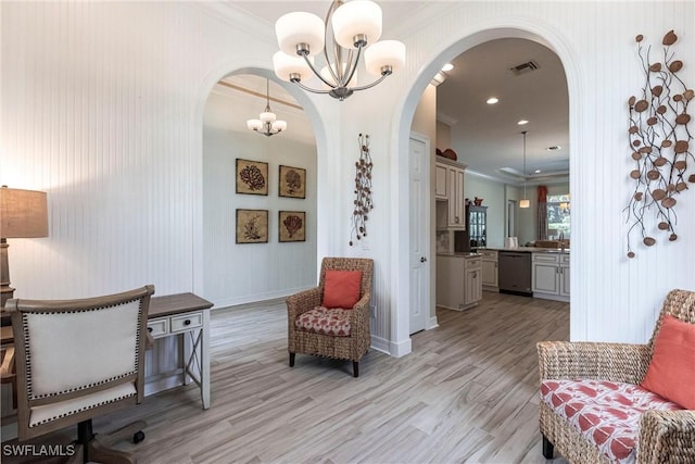 living area with visible vents, arched walkways, and crown molding