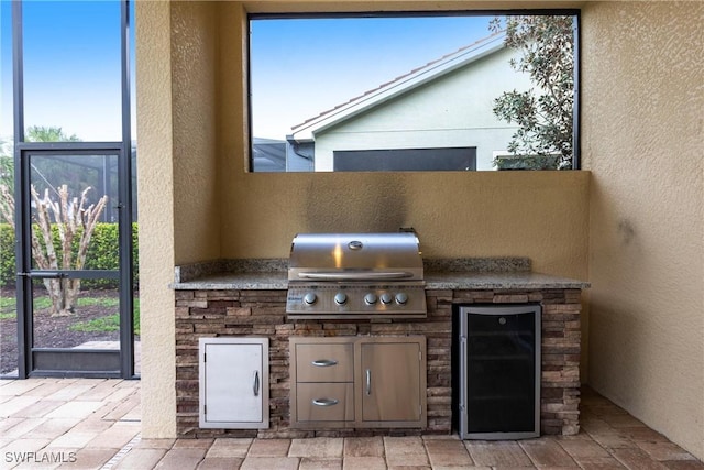 view of patio / terrace with grilling area and an outdoor kitchen