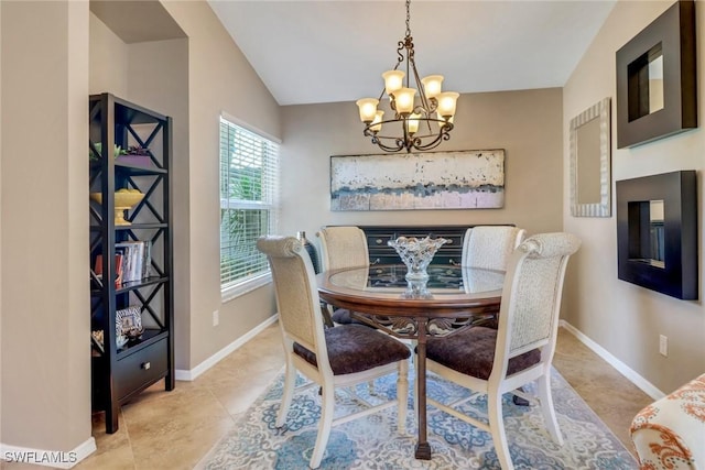 tiled dining area featuring vaulted ceiling and a notable chandelier