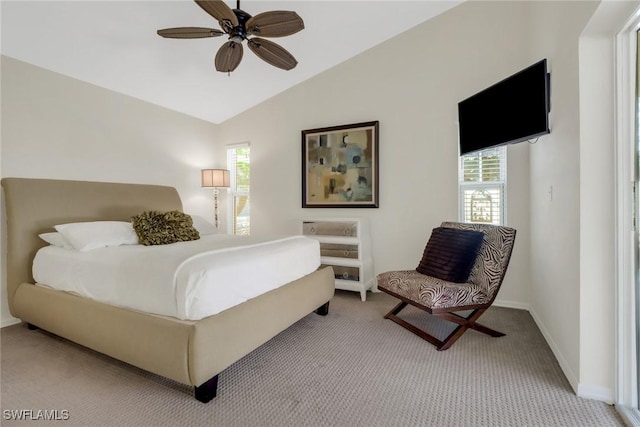 bedroom featuring vaulted ceiling, carpet floors, and ceiling fan