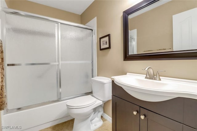 full bathroom with toilet, vanity, and bath / shower combo with glass door