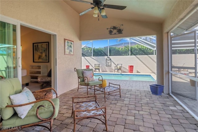 view of patio / terrace with a lanai and ceiling fan