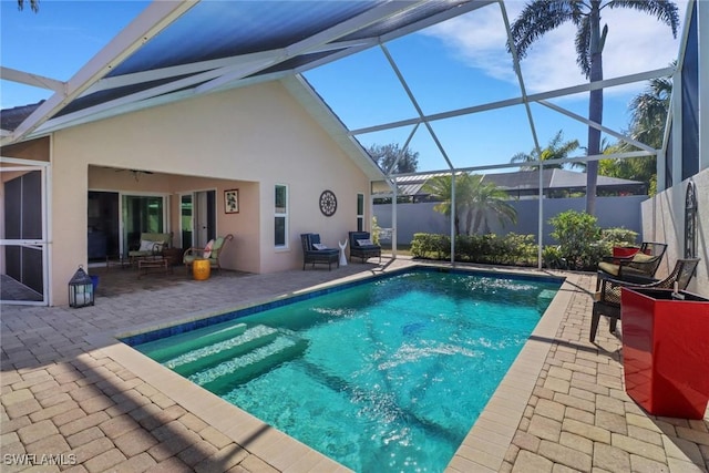 view of pool featuring a lanai and a patio