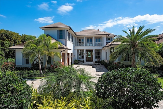 rear view of property with a balcony