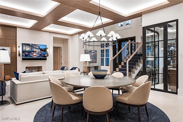 dining room featuring coffered ceiling, beam ceiling, and a chandelier