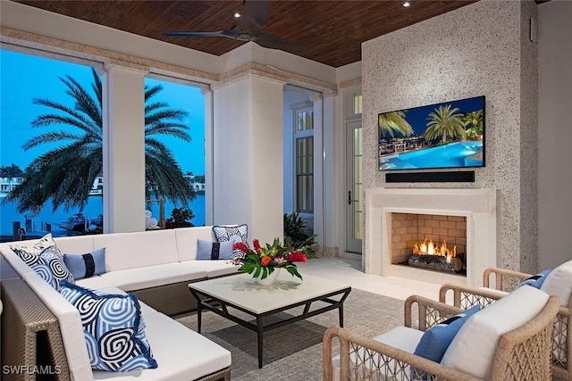 living room with ceiling fan and wood ceiling