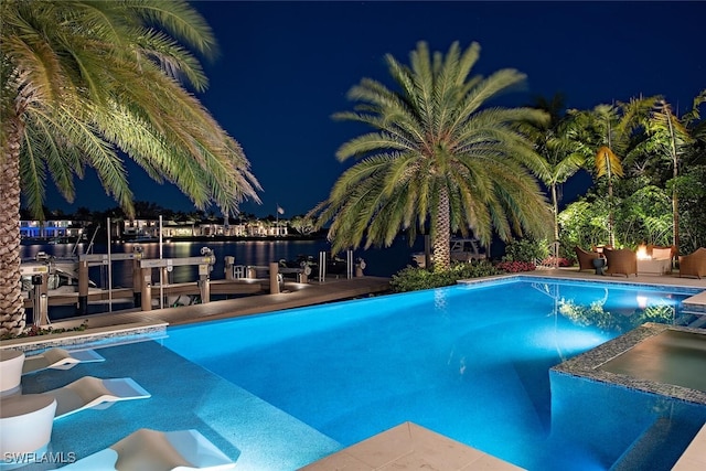 pool at night with a water view