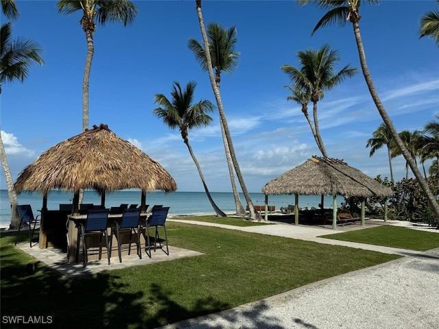 view of home's community featuring a gazebo, a water view, and a yard