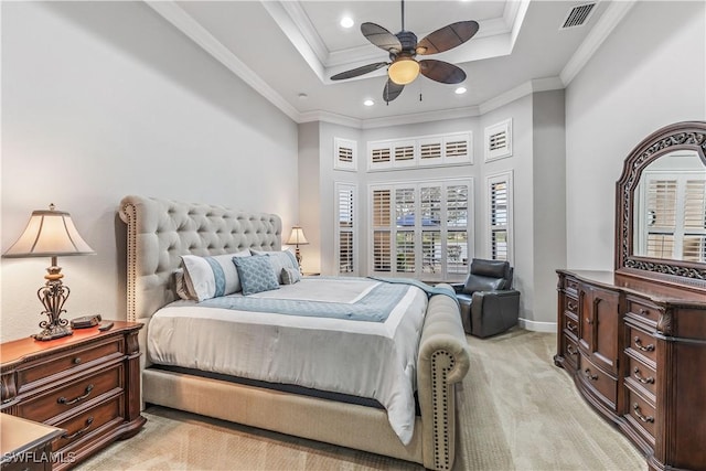 carpeted bedroom with crown molding, a tray ceiling, ceiling fan, and a high ceiling