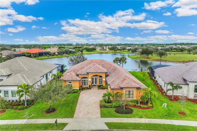 view of front of home featuring a water view and a front lawn