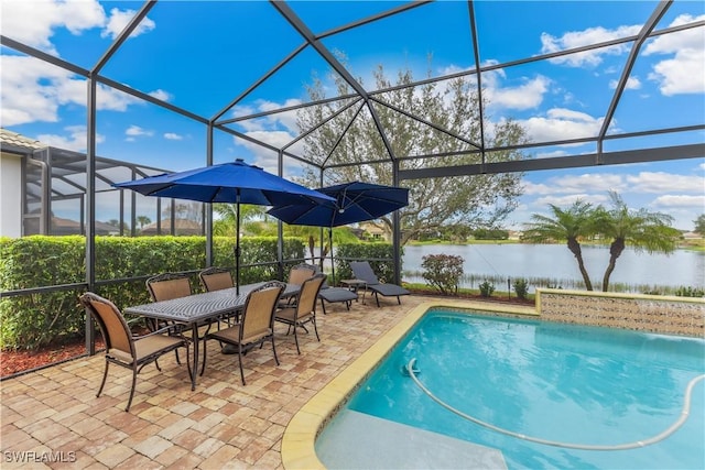 view of swimming pool with a water view, a lanai, and a patio