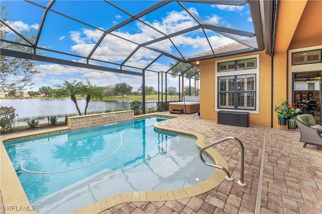 view of swimming pool with a water view, a patio, a hot tub, and glass enclosure