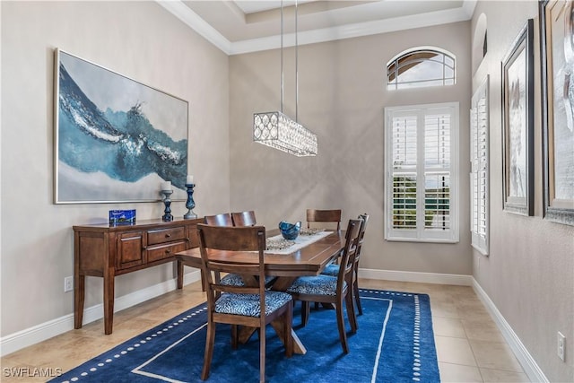 dining room with tile patterned flooring and ornamental molding