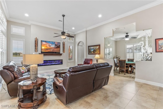 living room featuring light tile patterned floors, crown molding, and ceiling fan