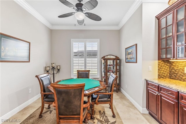 dining area featuring ornamental molding and ceiling fan