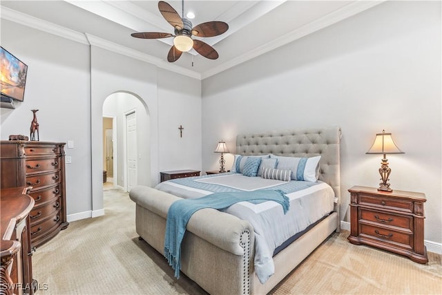 bedroom featuring crown molding, light colored carpet, and ceiling fan