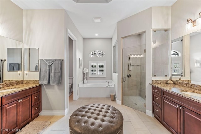 full bathroom with plus walk in shower, toilet, tile patterned floors, and vanity