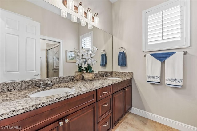 bathroom with tile patterned floors, vanity, and a shower with shower door