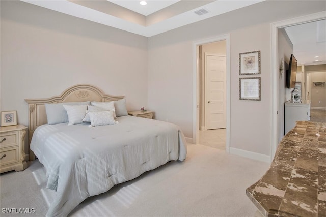 bedroom featuring light colored carpet