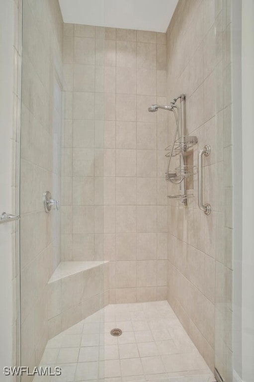 bathroom featuring a shower with shower door