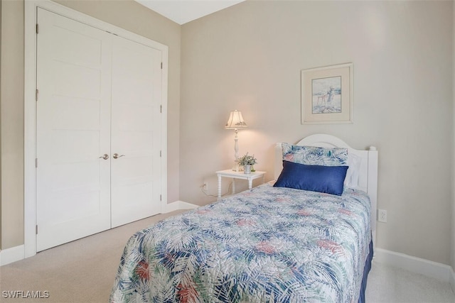 carpeted bedroom with a closet