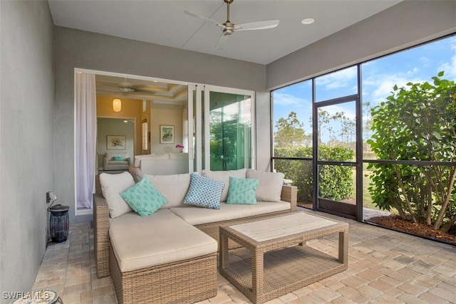 sunroom with ceiling fan