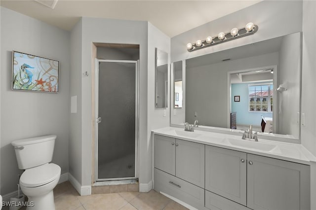 bathroom featuring vanity, toilet, an enclosed shower, and tile patterned flooring