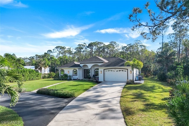 view of front of property with a garage and a front lawn