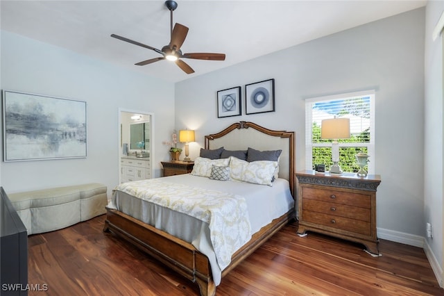 bedroom with dark wood-type flooring, ceiling fan, and connected bathroom