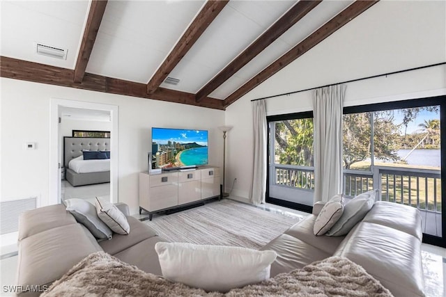 living room with vaulted ceiling with beams