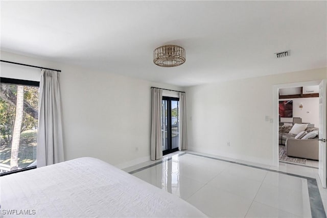 tiled bedroom with multiple windows