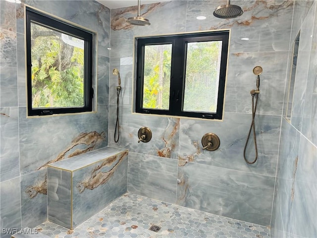 bathroom featuring a tile shower