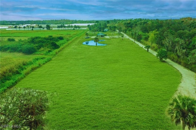 birds eye view of property featuring a rural view