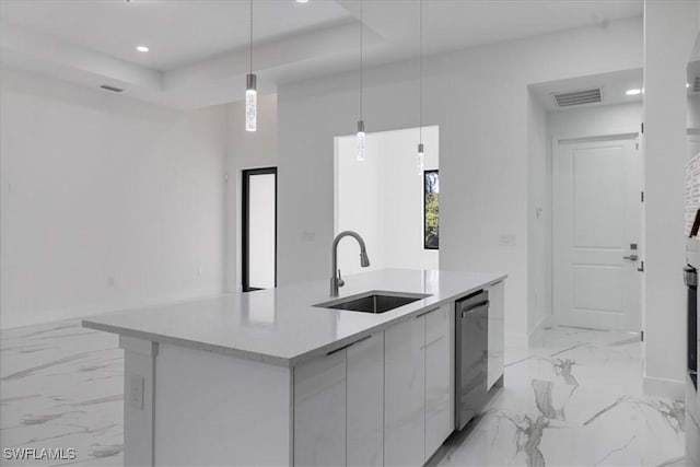 kitchen featuring sink, white cabinetry, hanging light fixtures, dishwasher, and an island with sink