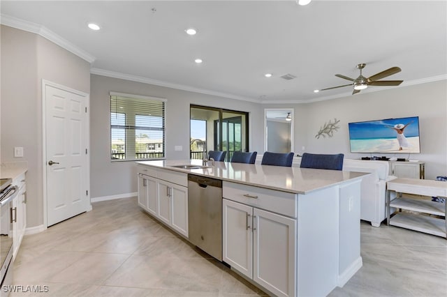 kitchen featuring sink, white cabinetry, a center island, ornamental molding, and stainless steel appliances