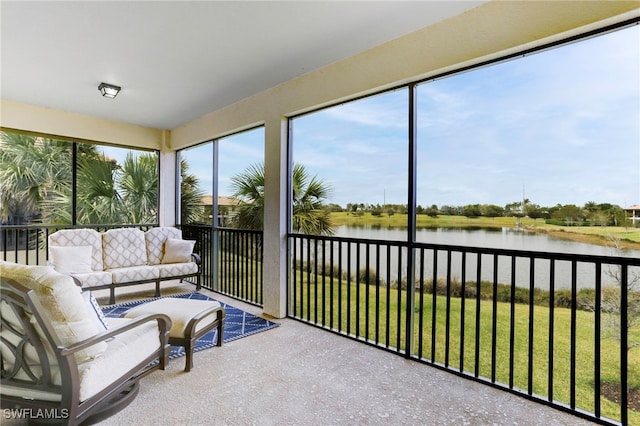 sunroom / solarium featuring a water view and a wealth of natural light