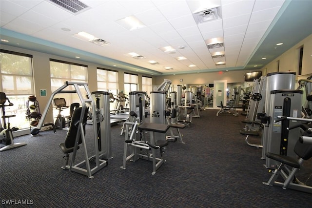 gym featuring a paneled ceiling