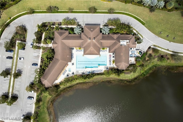 birds eye view of property with a water view