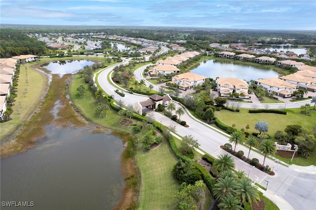 drone / aerial view with a water view