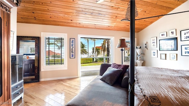 bedroom with light hardwood / wood-style flooring, vaulted ceiling, wooden ceiling, and access to outside