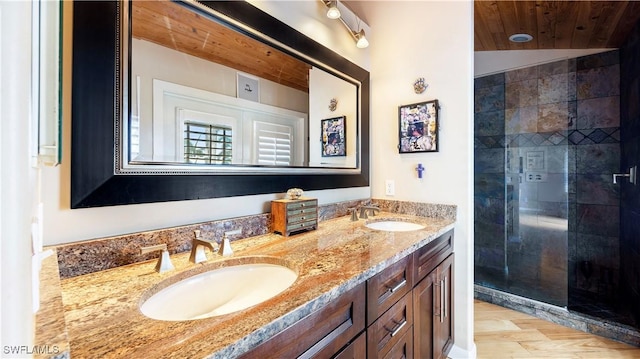 bathroom with vanity, tiled shower, and wooden ceiling