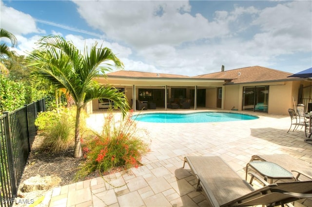 view of swimming pool with a patio