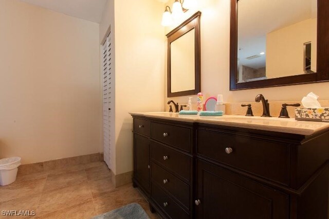 bathroom featuring tile patterned floors and vanity