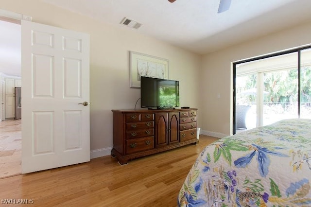 bedroom with stainless steel refrigerator, ceiling fan, access to exterior, and light hardwood / wood-style flooring