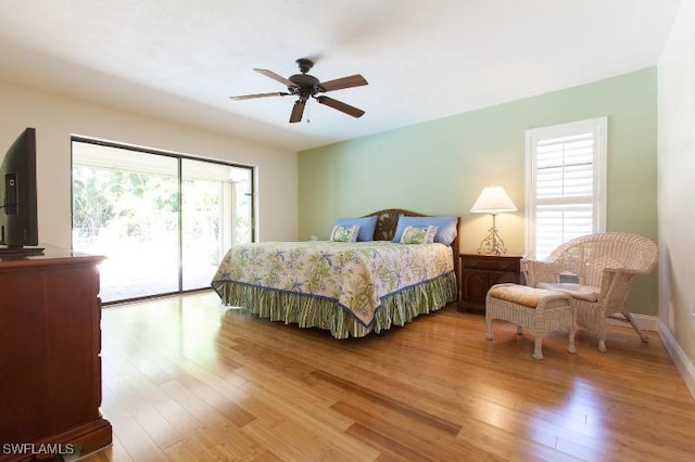 bedroom featuring access to outside, ceiling fan, and light hardwood / wood-style flooring