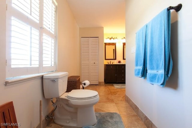 bathroom with vanity, toilet, and tile patterned flooring