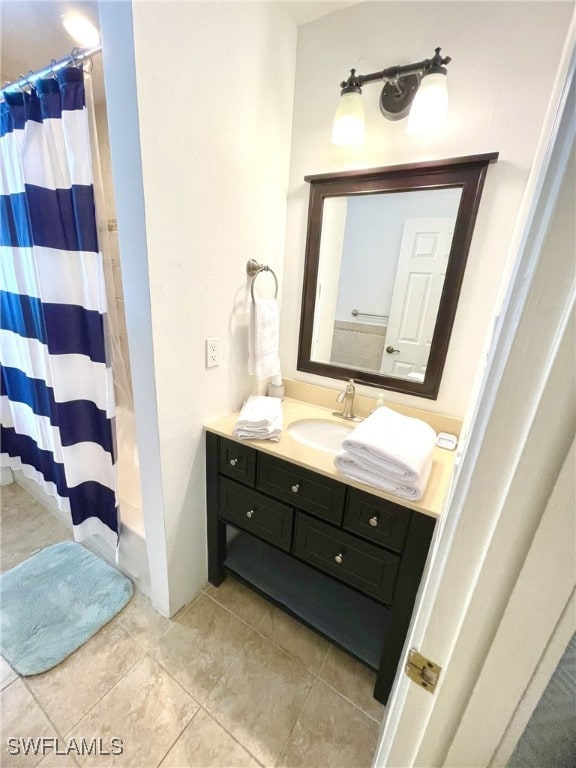 bathroom with vanity, tile patterned floors, and walk in shower