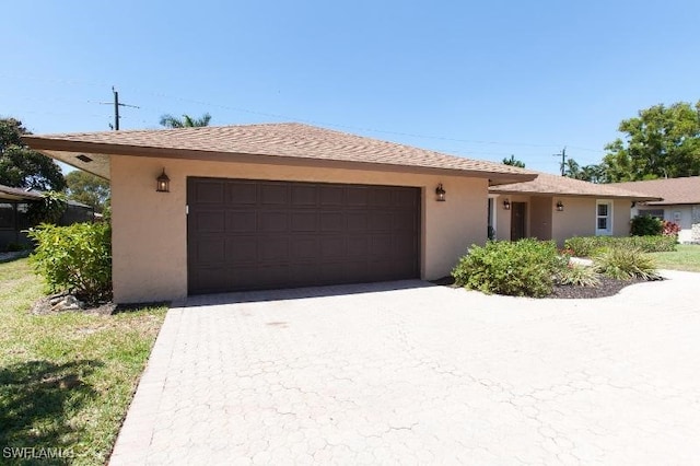 ranch-style home with a garage